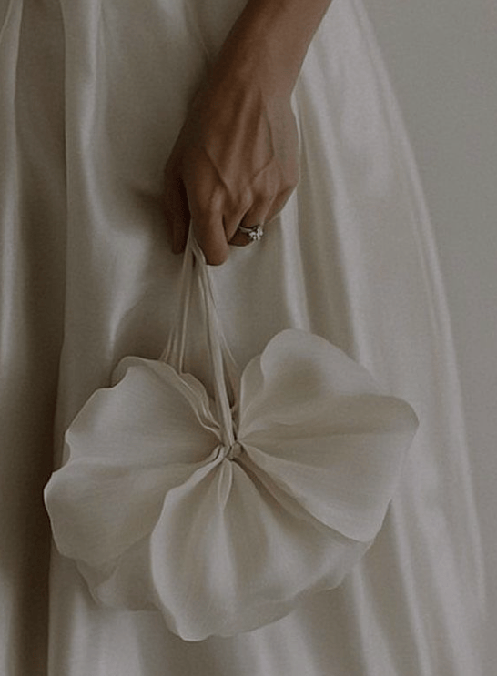 model holding zarella design white mini bag