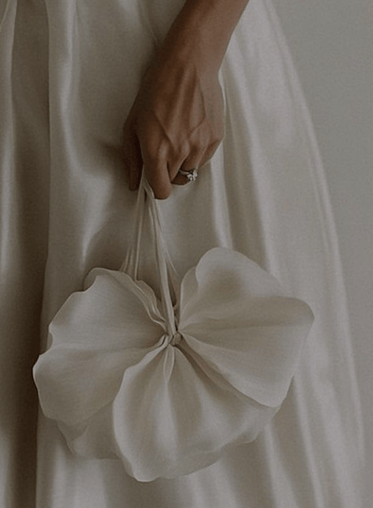 model holding zarella design white mini bag