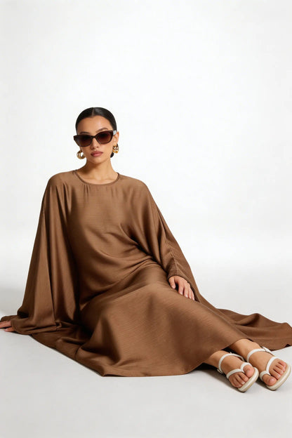 model wearing Kaftan dress back side back view zarella design