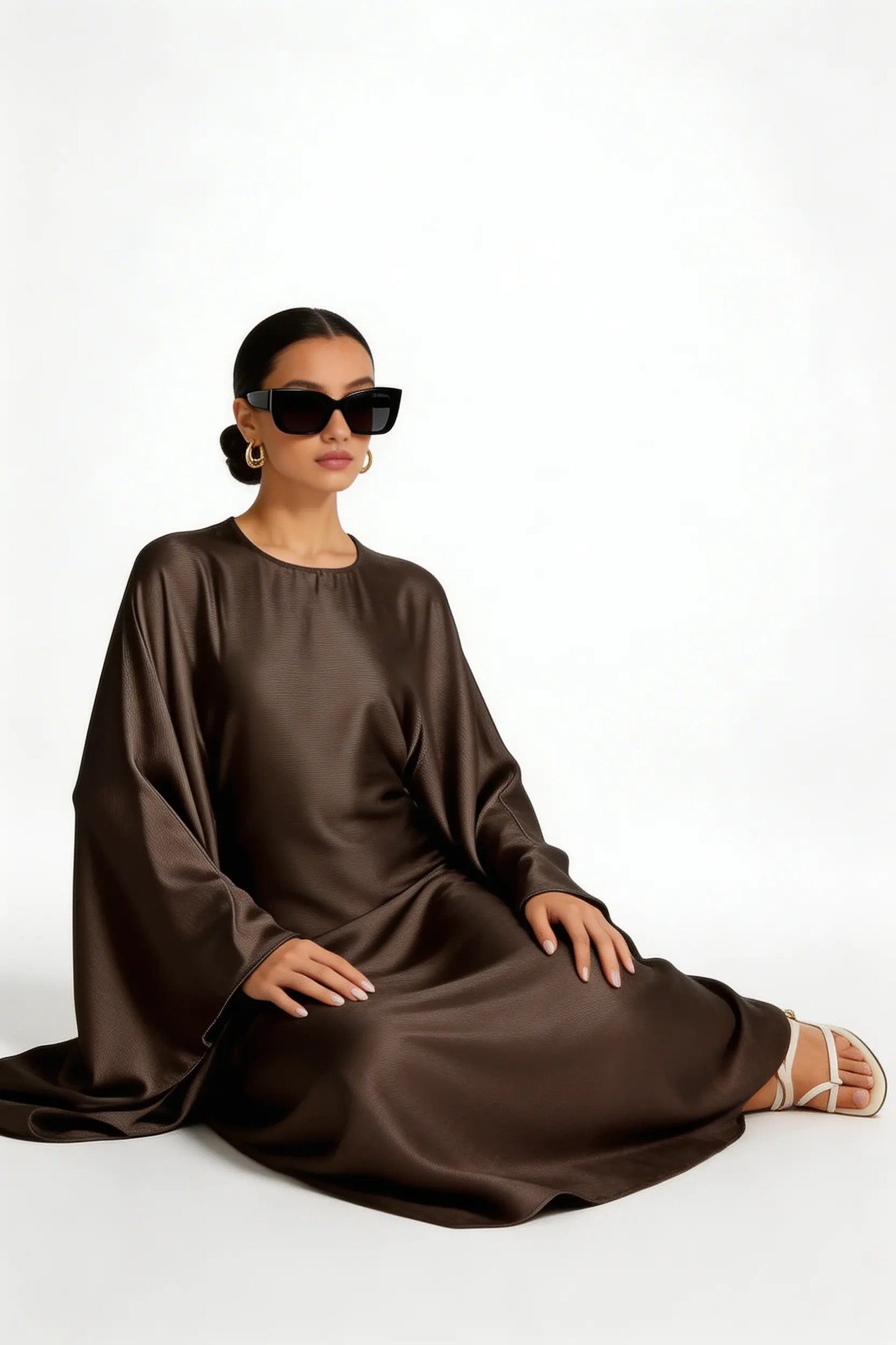 model wearing Kaftan dress sitting front side view