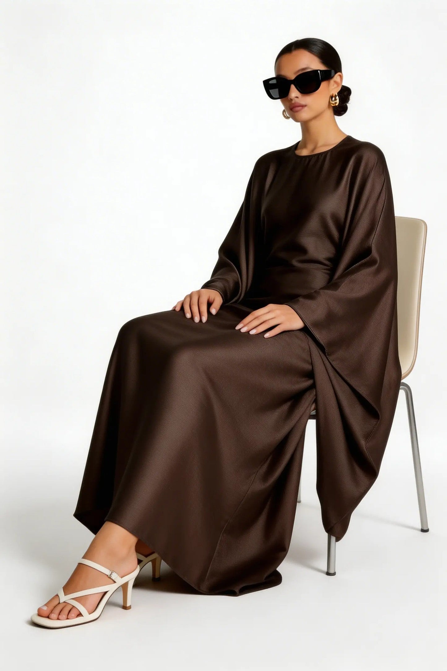 model wearing Kaftan dress sitting view